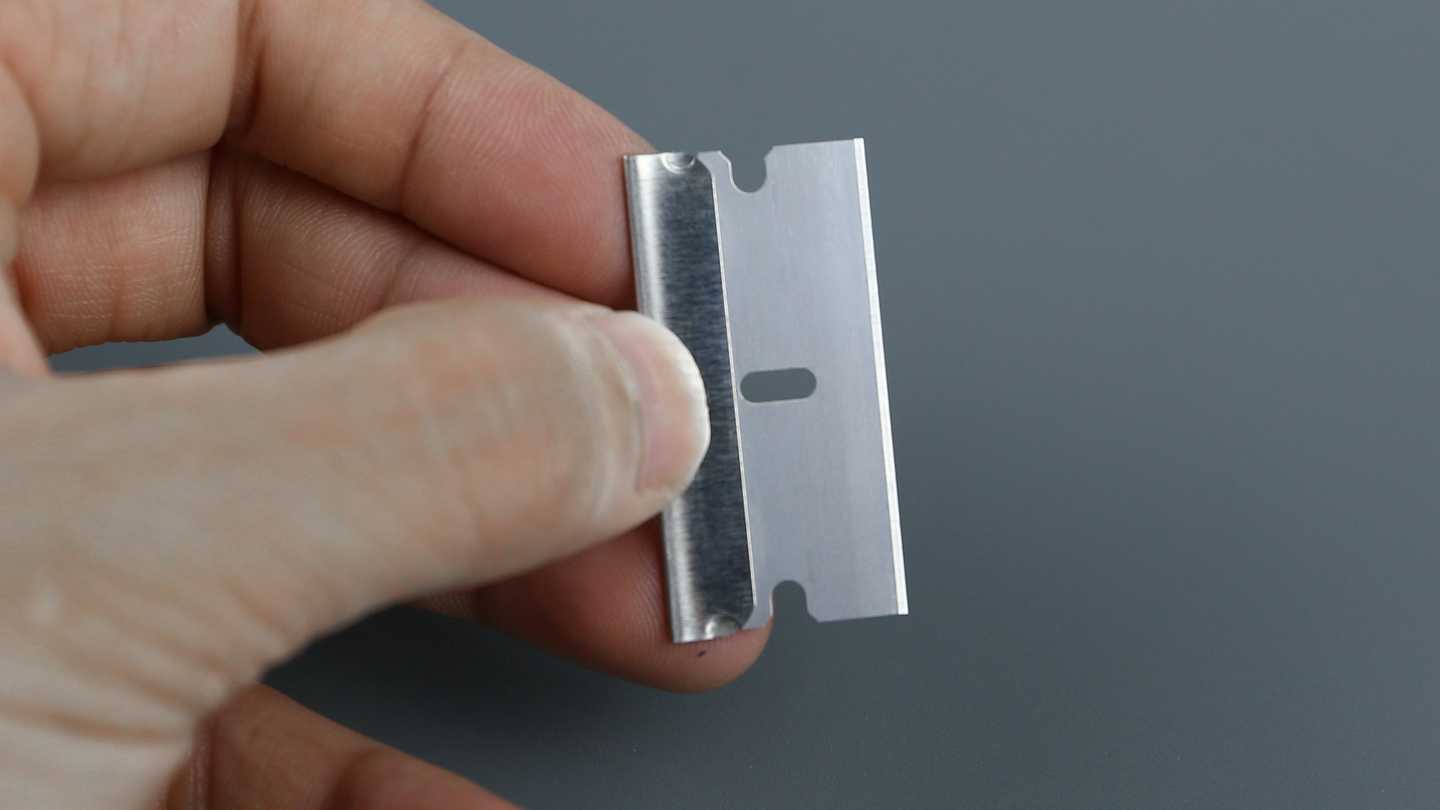 The blade covered by protective safety guard.