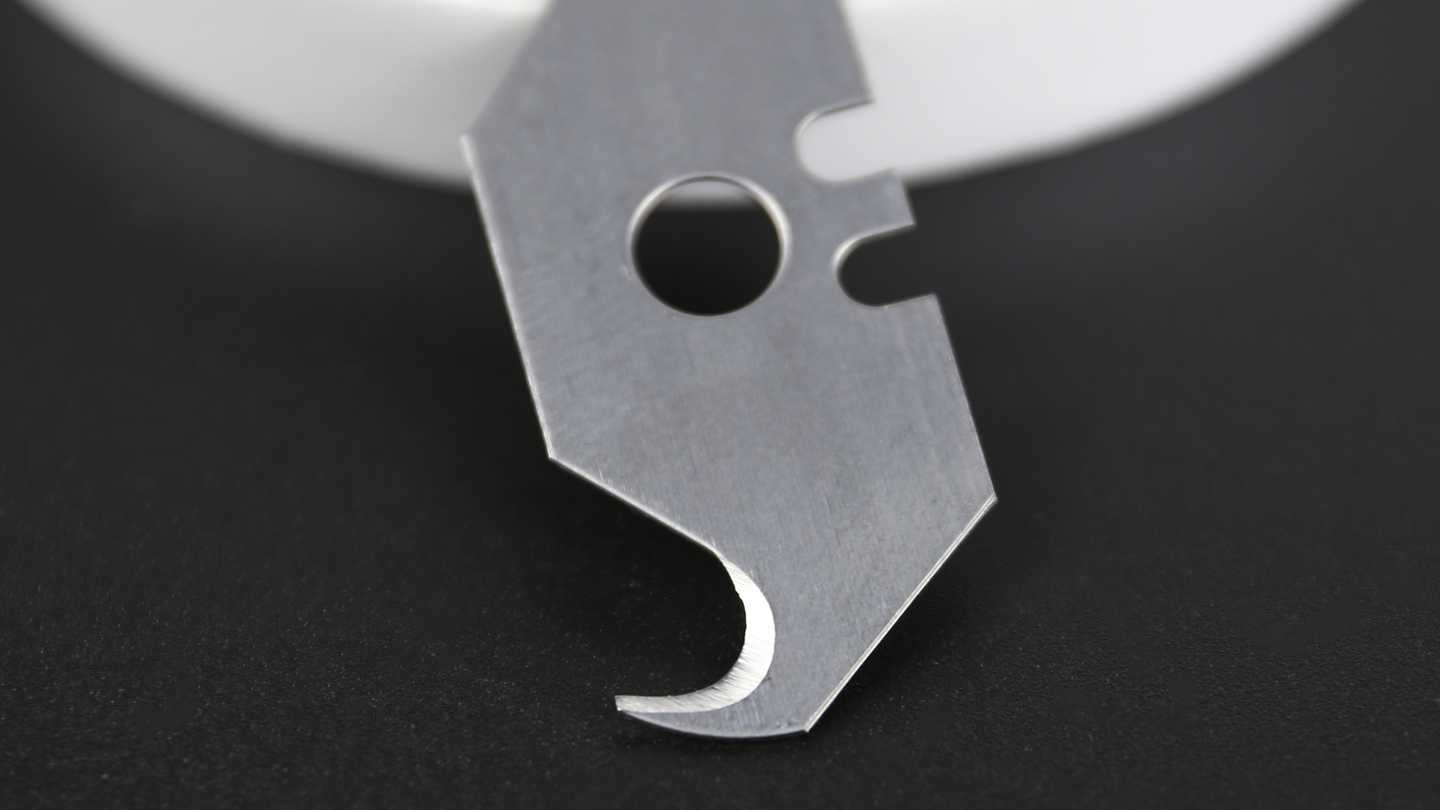 The blade covered by protective safety guard.